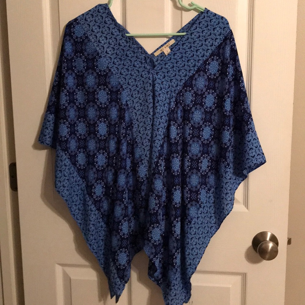 Poncho like shirt but has the arm space closed